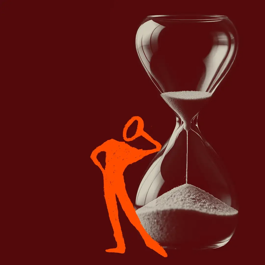 Orange figure waiting beside an hourglass